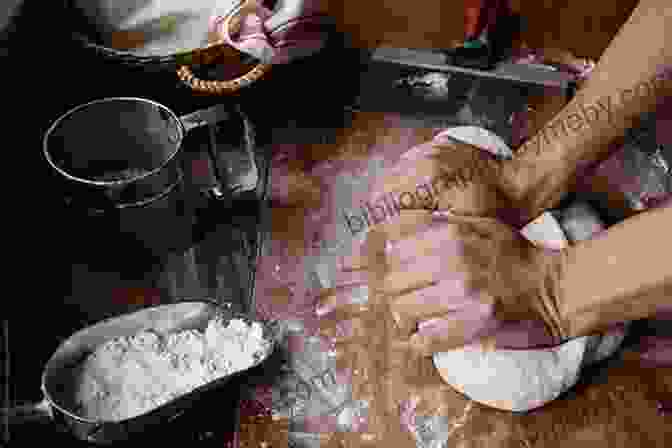 A Baker's Hands Kneading Dough On A Wooden Table 32 Small Breads Gia Scott