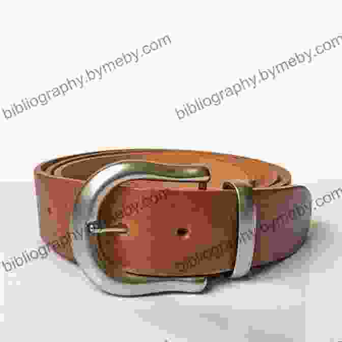 A Close Up Of A Brown Leather Belt With A Silver Buckle Emergence (The Belt 6)