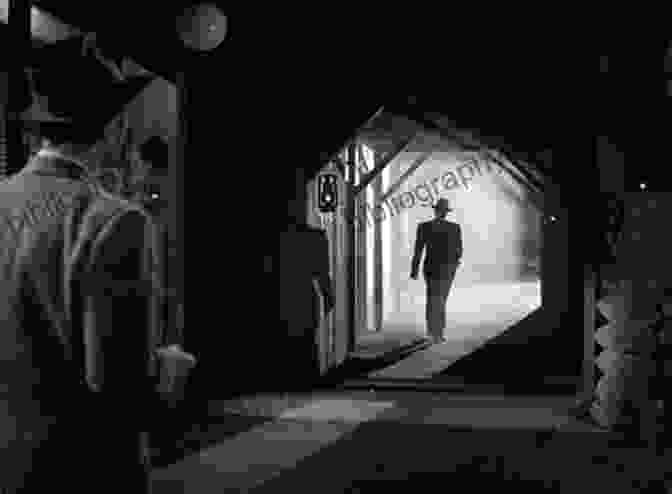 A Dark And Eerie Alleyway Shot From A Film Noir Movie, With Shadows Obscuring The Scene And Adding To The Suspenseful Atmosphere The Crime Films Of Anthony Mann