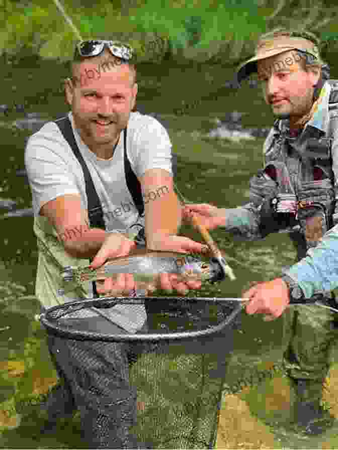 Angler Holding A Rainbow Trout Caught On A Nymph Nymph Fishing: New Angles Tactics And Techniques