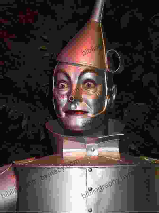 The Tin Woodman From The Wizard Of Oz Wearing A Metal Suit And Holding An Axe The Tin Woodman Of Oz